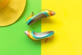 Fashion woman accessories set. Trendy fashion colorful shoes heels, stylish yellow big hat. Colorful green and yellow background. Royalty Free Stock Photo