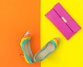 Fashion woman accessories set. Trendy fashion shoes heels, stylish handbag clutch. Colorfull background. Royalty Free Stock Photo