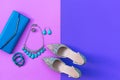 Fashion woman accessories set. Trendy fashion shoes heels, stylish handbag clutch, necklace, bracelet and ring, pink and purple ba Royalty Free Stock Photo