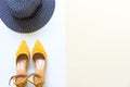 Fashion woman accessories set. Trendy fashion yellow shoes heels, stylish big hat. Colorfull background. Royalty Free Stock Photo