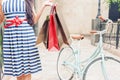 Fashion woman with bags and bike, shopping travel to Italy Royalty Free Stock Photo