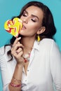 Fashion. Woman With Beauty Face Makeup Holding Candy. Royalty Free Stock Photo