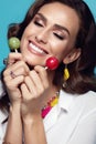 Fashion. Woman With Beauty Face Makeup Holding Candy. Royalty Free Stock Photo