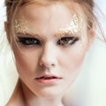 Fashion woman - beauty gilded golden make-up