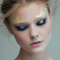 Fashion woman - beauty gilded golden make-up