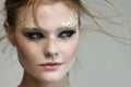 Fashion woman - beauty gilded golden make-up