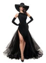 Fashion Woman in Black Evening Dress isolated White. Elegant Lady in Black Summer Hat and Long Luxury Gown with Slit. Beautiful