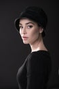 Fashion woman. Black and white portrait of beautiful young elegant lady in black dress and hat. Vintage styling. Beauty, fashion, Royalty Free Stock Photo