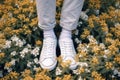 fashion woman grass green spring sneakers lifestyle flowers white female positive. Generative AI.