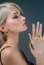 Fashion woman with jewelry set. Girl with fashionable jewelry earrings and ring Royalty Free Stock Photo