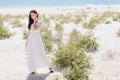 Fashion Woman in Long White Dress on the Beach Royalty Free Stock Photo