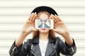 Fashion woman makes self portrait on smartphone view screen