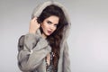 Fashion woman in mink fur coat, lady portrait. fashionable studio photo of gorgeous sensual brunette woman in mink hood Royalty Free Stock Photo