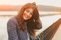 Fashion woman outdoor portrait. Beautiful girl posing on the street in black coat. Photo toned style instagram filters Royalty Free Stock Photo