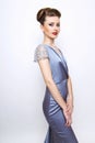 Fashion woman portrait. young model wearing silver evening dress. Royalty Free Stock Photo