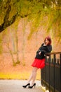 Fashion woman relaxing walking in autumn park Royalty Free Stock Photo