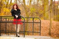 Fashion woman relaxing walking in autumn park Royalty Free Stock Photo