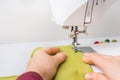 Fashion woman sews with sewing machine Royalty Free Stock Photo