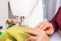 Fashion woman sews with sewing machine Royalty Free Stock Photo