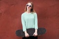 Fashion woman with a skateboard. Girl in sunglasses with longboard Royalty Free Stock Photo