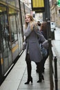 Fashion woman waiting the tram Royalty Free Stock Photo