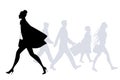 Fashion woman walking in the street. People silhouettes walking Royalty Free Stock Photo