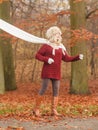 Fashion woman in windy fall autumn park forest. Royalty Free Stock Photo