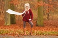 Fashion woman in windy fall autumn park forest. Royalty Free Stock Photo