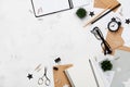 Fashion woman working desk with eyeglasses, supply, alarm clock and notebook top view. Flat lay style. Copy space for text.