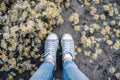 fashion woman yellow lifestyle white grass sneakers green female spring flowers. Generative AI.