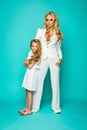 Fashion woman with preatty little girl posing Royalty Free Stock Photo