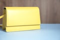 Fashion yellow bag on table Royalty Free Stock Photo