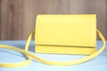 Fashion yellow bag on table Royalty Free Stock Photo