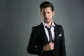 Fashion young businessman black suit casual tie Royalty Free Stock Photo