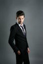 Fashion young businessman black suit casual tie