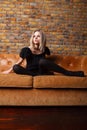 Fashion young girl on leather sofa