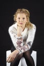 Fashion - Young woman with pullover and black stockings Royalty Free Stock Photo
