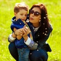 Fashionable baby boy and his gorgeous mother Royalty Free Stock Photo