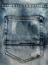 Fashionable shabby back jeans pocket close-up, navy denim texture, double rough straight stitch on jeans
