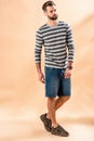 Fashionable bearded man posing in striped sweatshirt Royalty Free Stock Photo