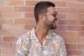 Fashionable bearded man wearing sunglasses and hawaiian style shirt Royalty Free Stock Photo