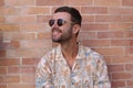 Fashionable bearded man wearing sunglasses and hawaiian style shirt Royalty Free Stock Photo