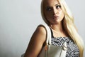 Fashionable beautiful blond woman with with handbag. shopping Royalty Free Stock Photo