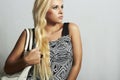 Fashionable beautiful blond woman with with handbag. shopping Royalty Free Stock Photo