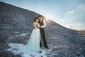 Fashionable and beautiful couple, happy blonde model girl with stylish hairstyle, in a white lace dress and stylish Royalty Free Stock Photo