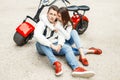 Fashionable beautiful couple in jeans clothes in red shoes Royalty Free Stock Photo