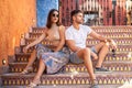 Fashionable beautiful couple posing together. Beautiful brunette woman and handsome italian man Royalty Free Stock Photo