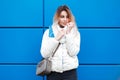 Fashionable beautiful woman with a stylish white knitted scarf Royalty Free Stock Photo