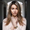 Fashionable beautiful young girl in a pink sweater Royalty Free Stock Photo