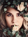 Fashionable beautiful young woman with a flower in her mouth Royalty Free Stock Photo